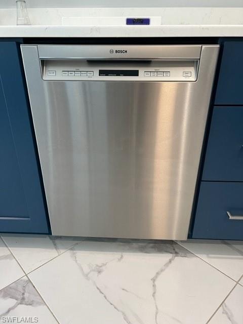 Bosch very quiet dishwasher, blue cabinets, and light porcelain tile floors