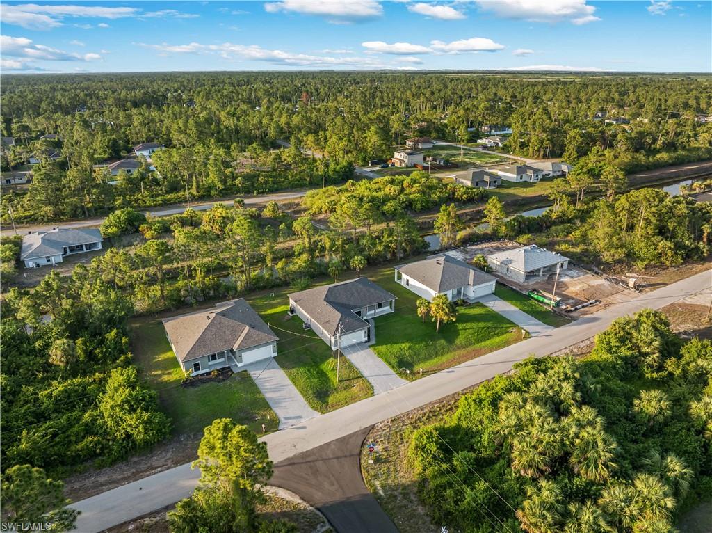 Aerial view of residential area with a forest