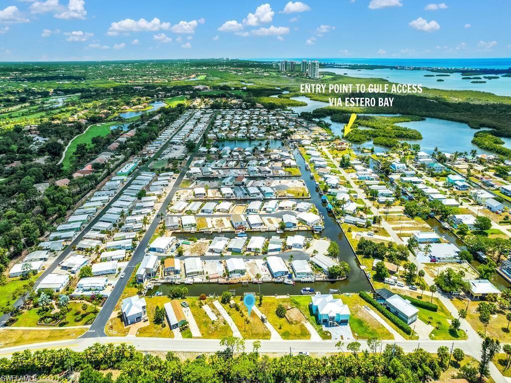 Aerial view of the entire community with exit/entry point to Estero Bay