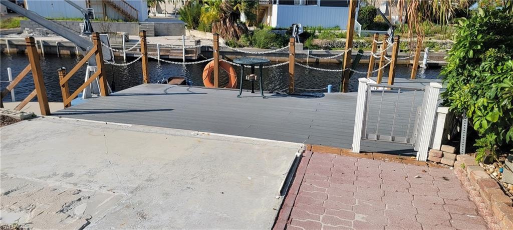 Dock area featuring a water view