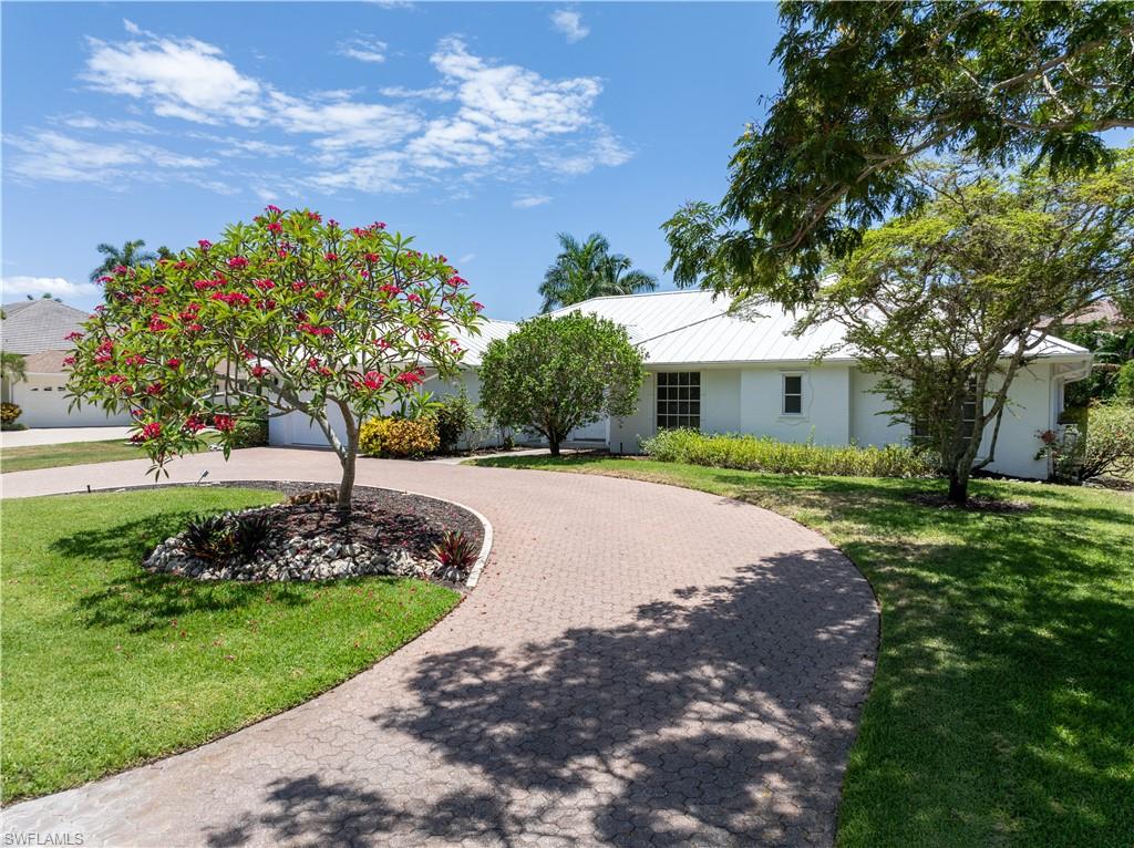 Ranch-style home with a front yard