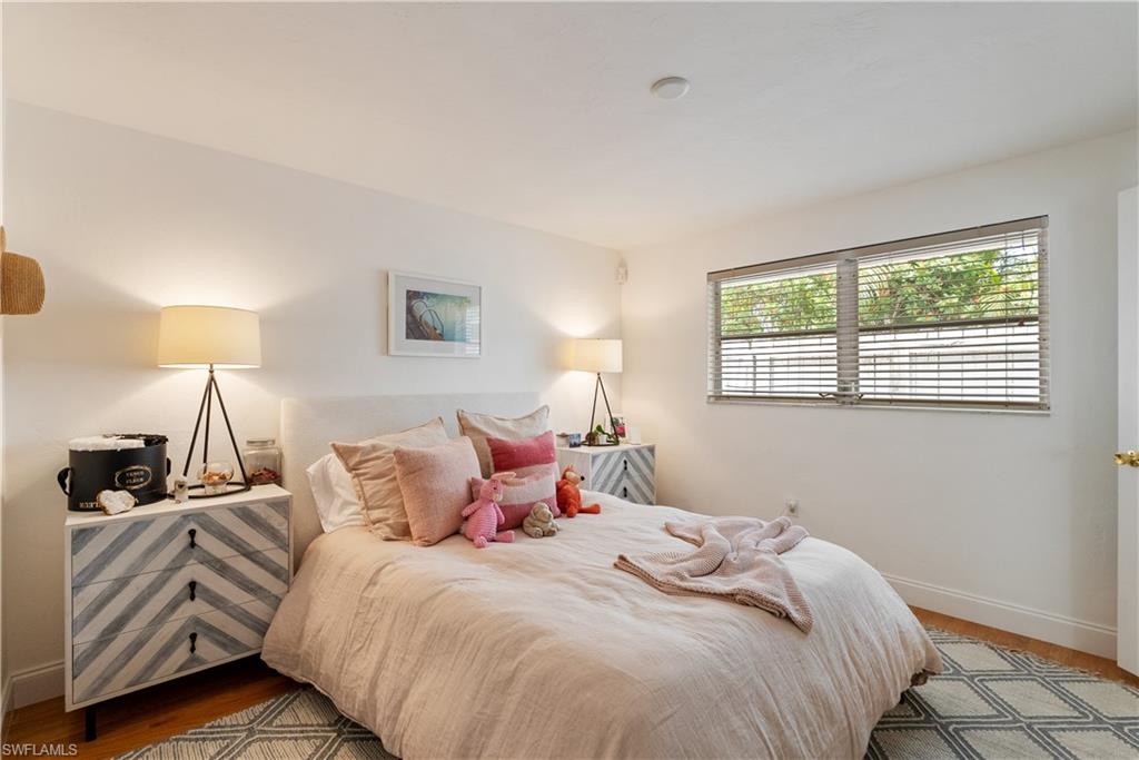Bedroom with wood-type flooring