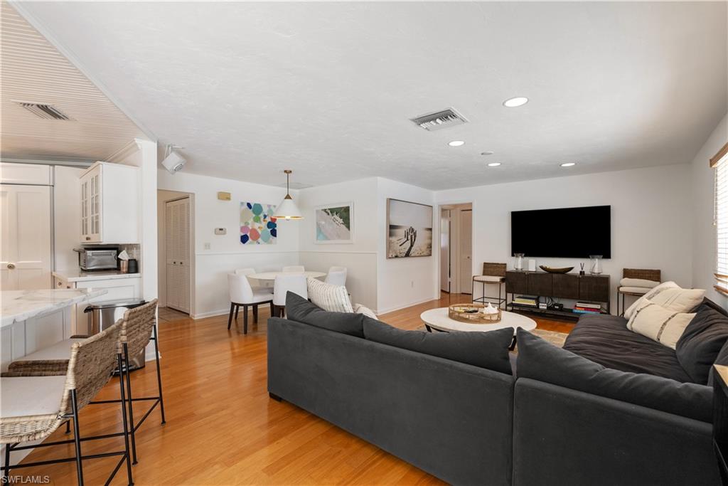 Living room with light wood-type flooring