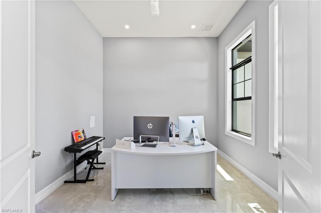 Tiled home office with a healthy amount of sunlight