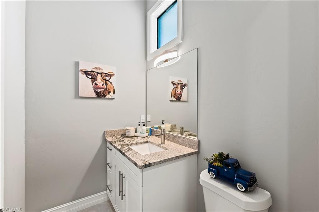 Bathroom featuring vanity and toilet
