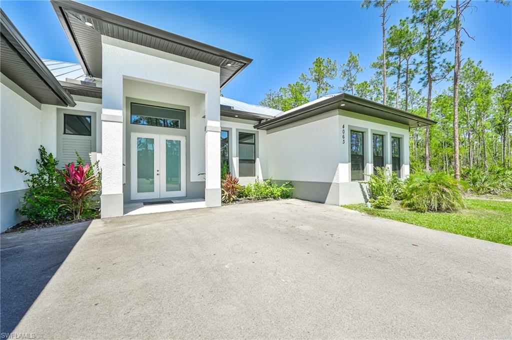 Property entrance featuring french doors