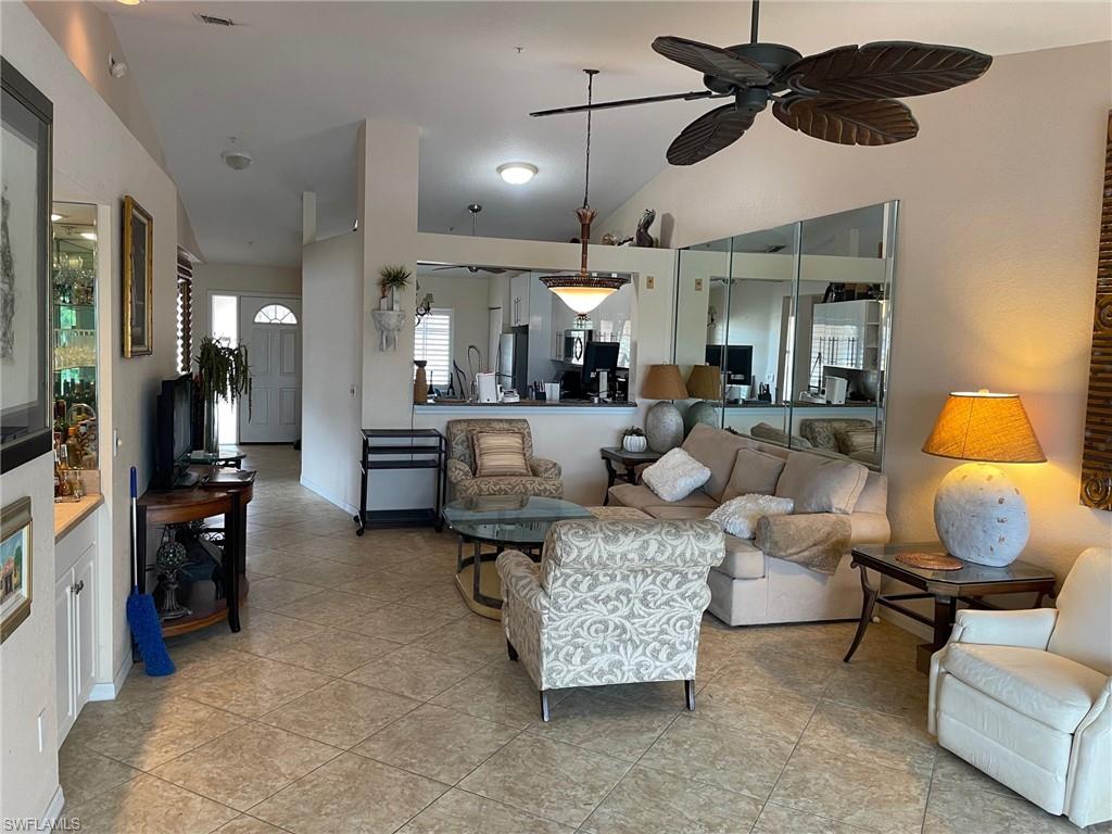 Living room with tile floors and ceiling fan