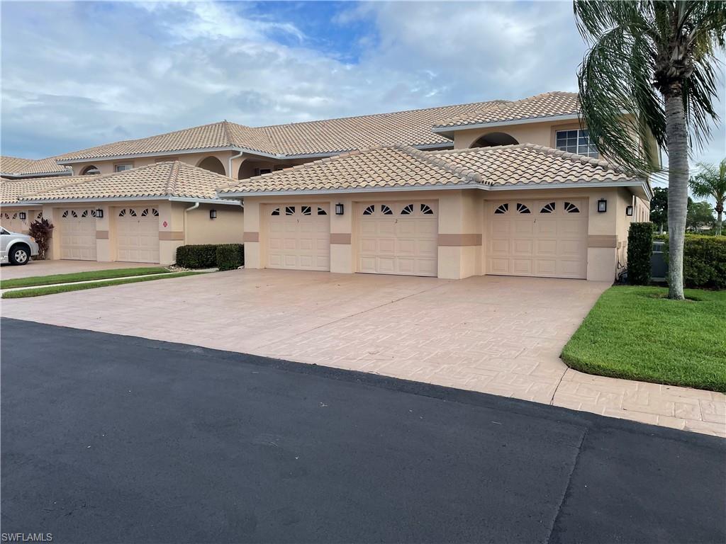 Mediterranean / spanish-style home featuring a garage