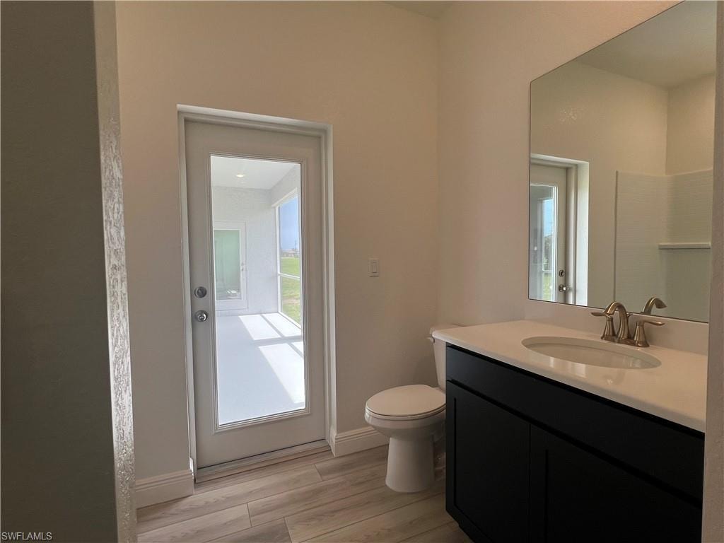 Bathroom with vanity and wood finished floors