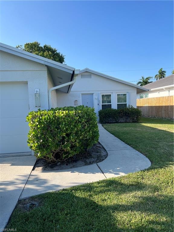 View of front facade with a garage and a front yard