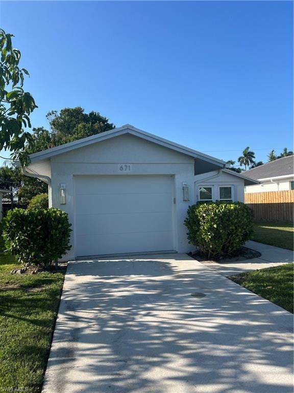 Ranch-style home with a front yard