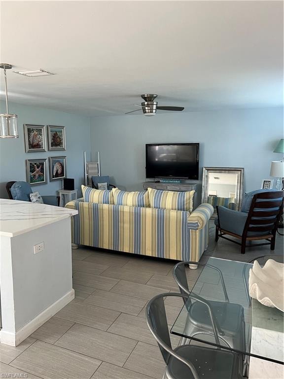 Living room featuring ceiling fan