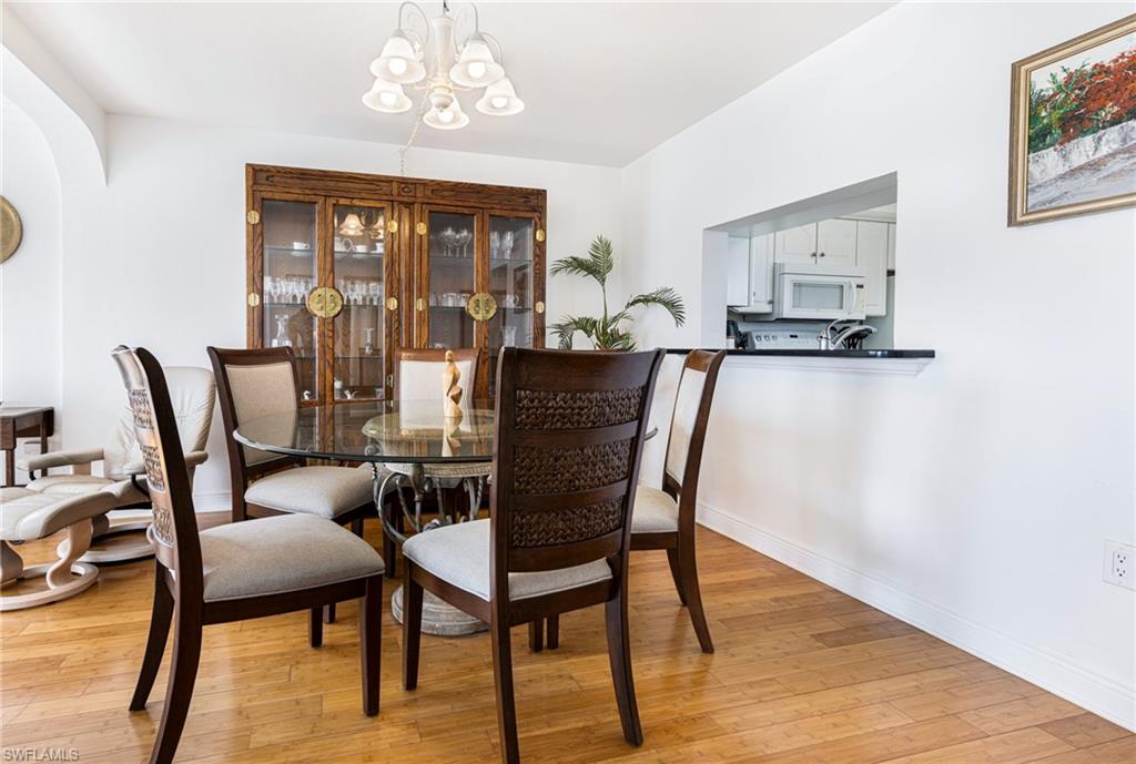 Dining space featuring an inviting chandelier and light hardwood / wood-style floors