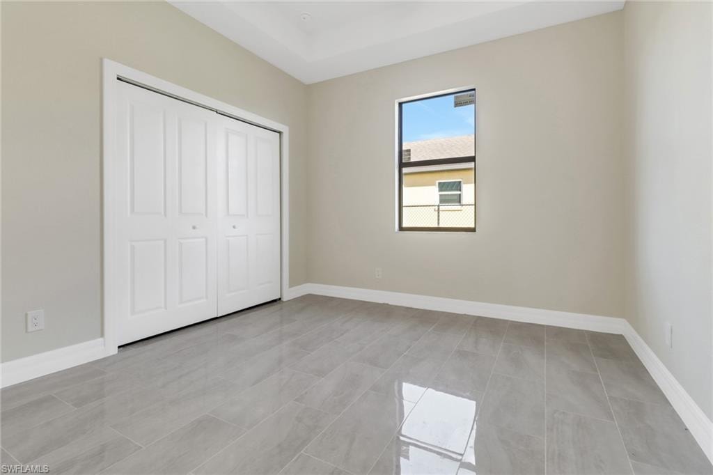 Unfurnished bedroom with a closet