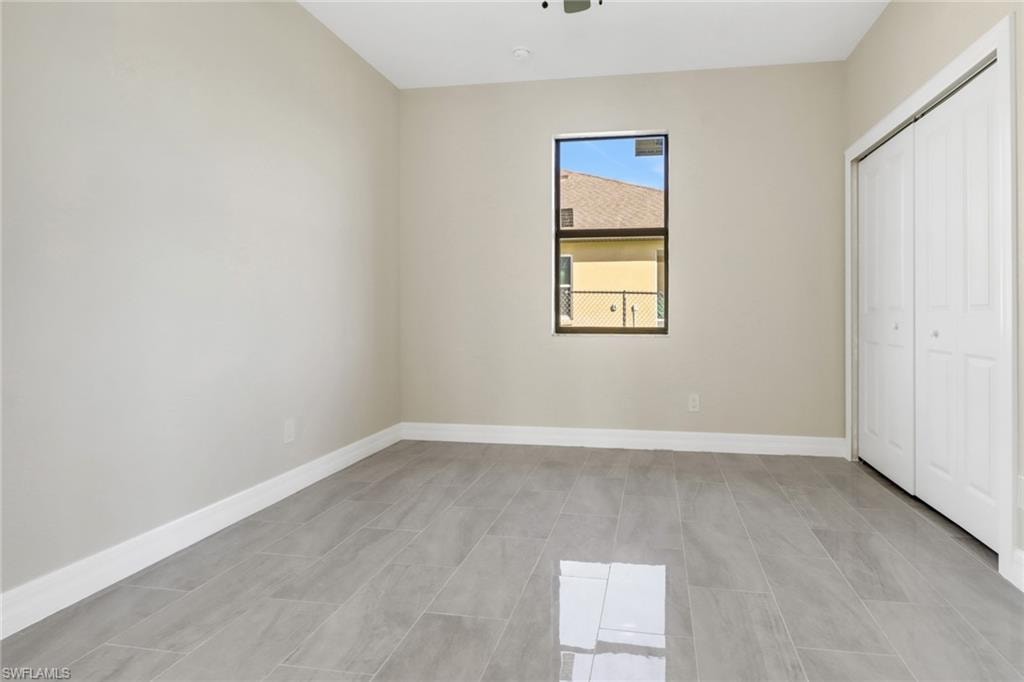 Unfurnished bedroom with a closet