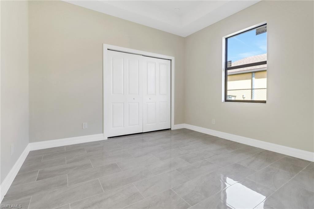Unfurnished bedroom with a closet