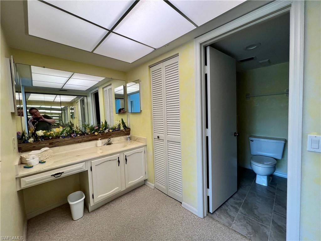 Bathroom with tile patterned floors, vanity, and toilet