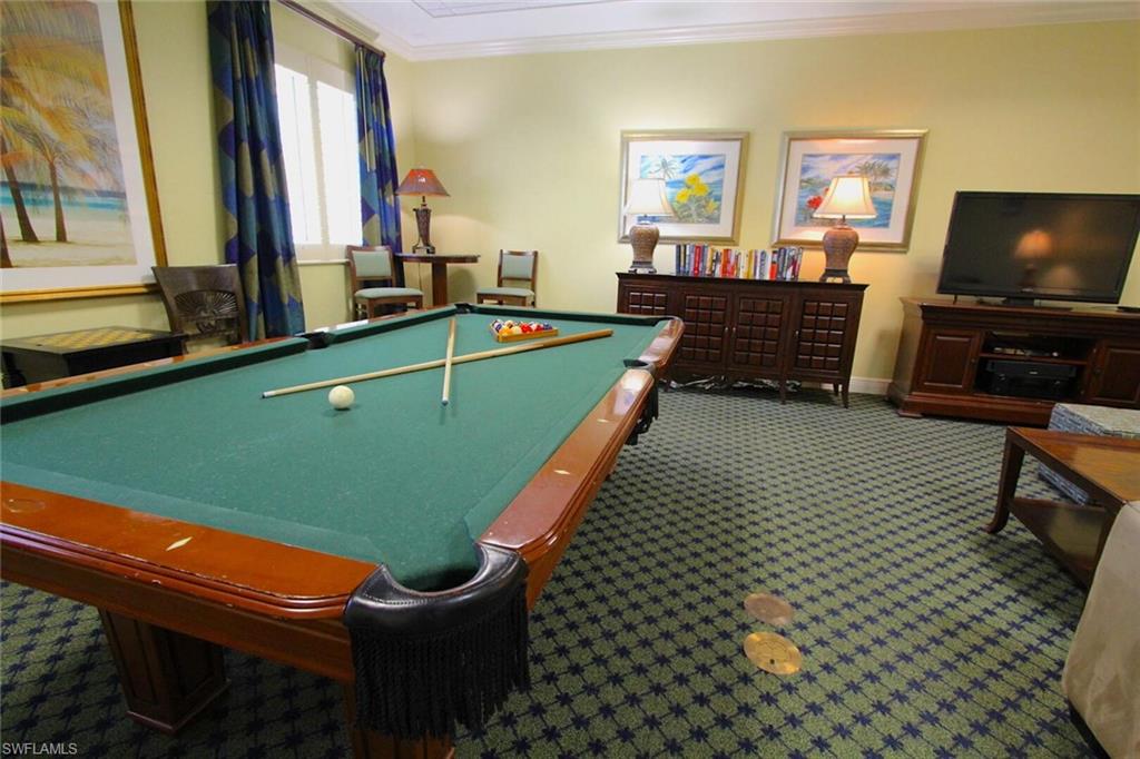 Billiards room featuring pool table, carpet floors, a small library and games