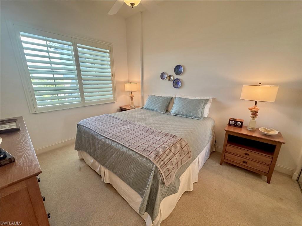 Guest bedroom featuring ceiling fan and connected guest bathroom