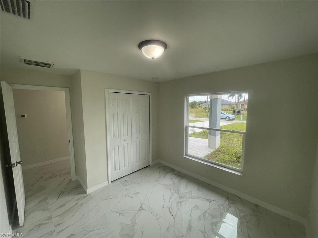 Unfurnished bedroom featuring a closet