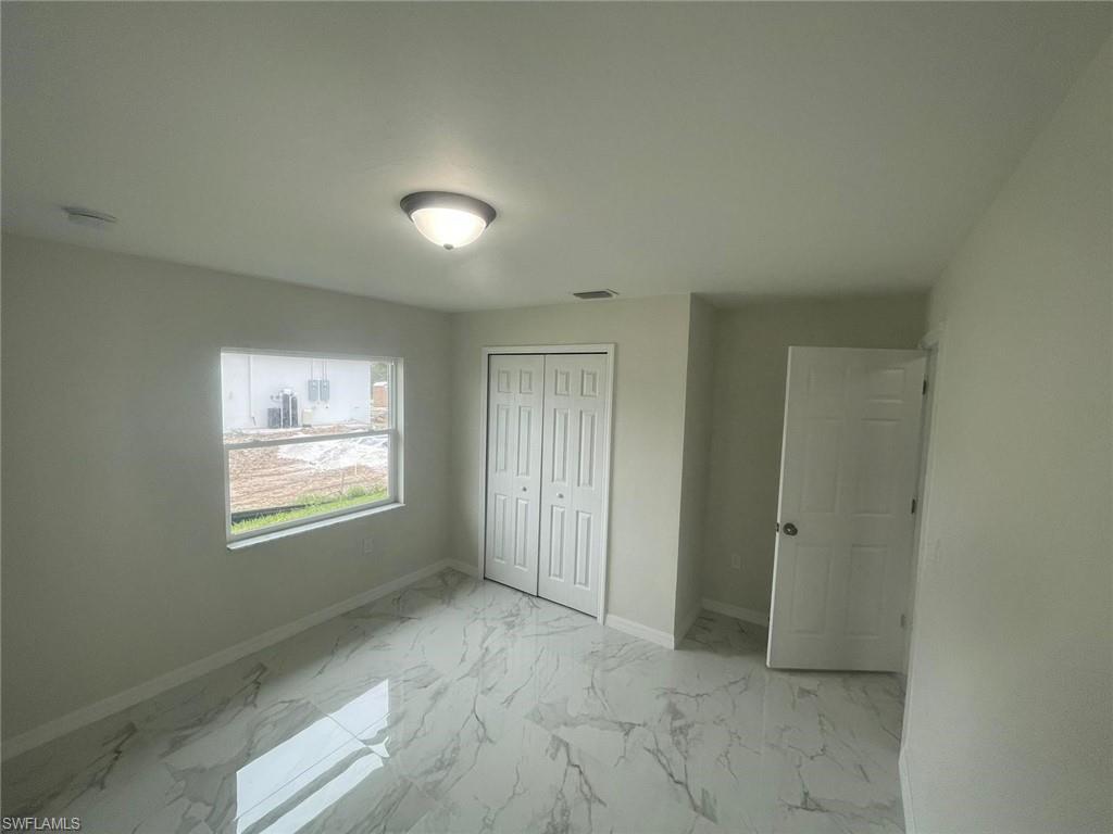 Unfurnished bedroom with a closet