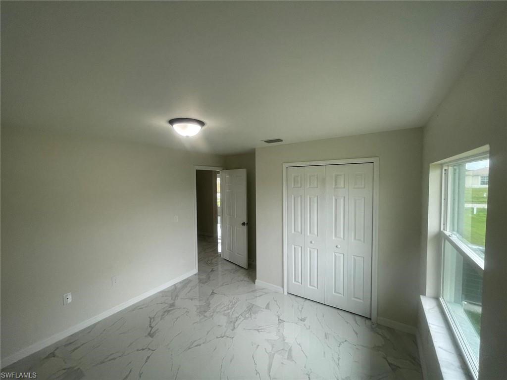 Unfurnished bedroom with a closet