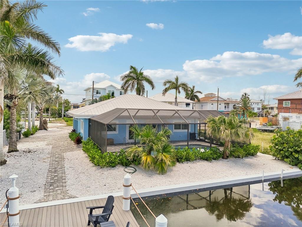 Rear view of property with a lanai