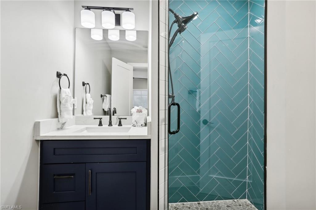 Bathroom with vanity and an enclosed shower