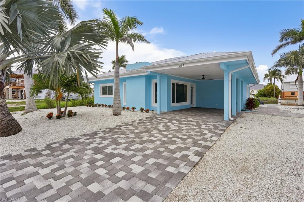 Back of property featuring a patio and ceiling fan