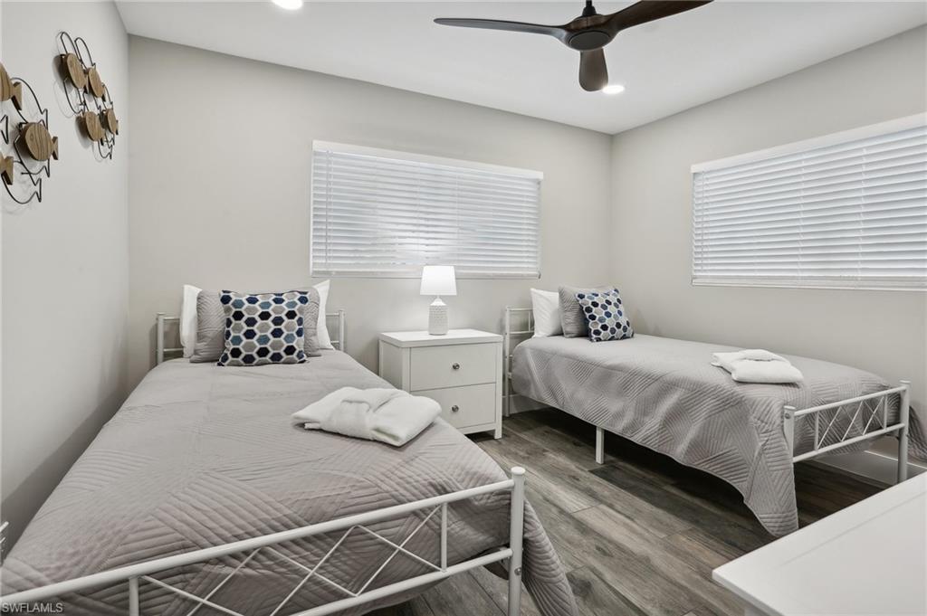 Bedroom featuring hardwood / wood-style flooring and ceiling fan