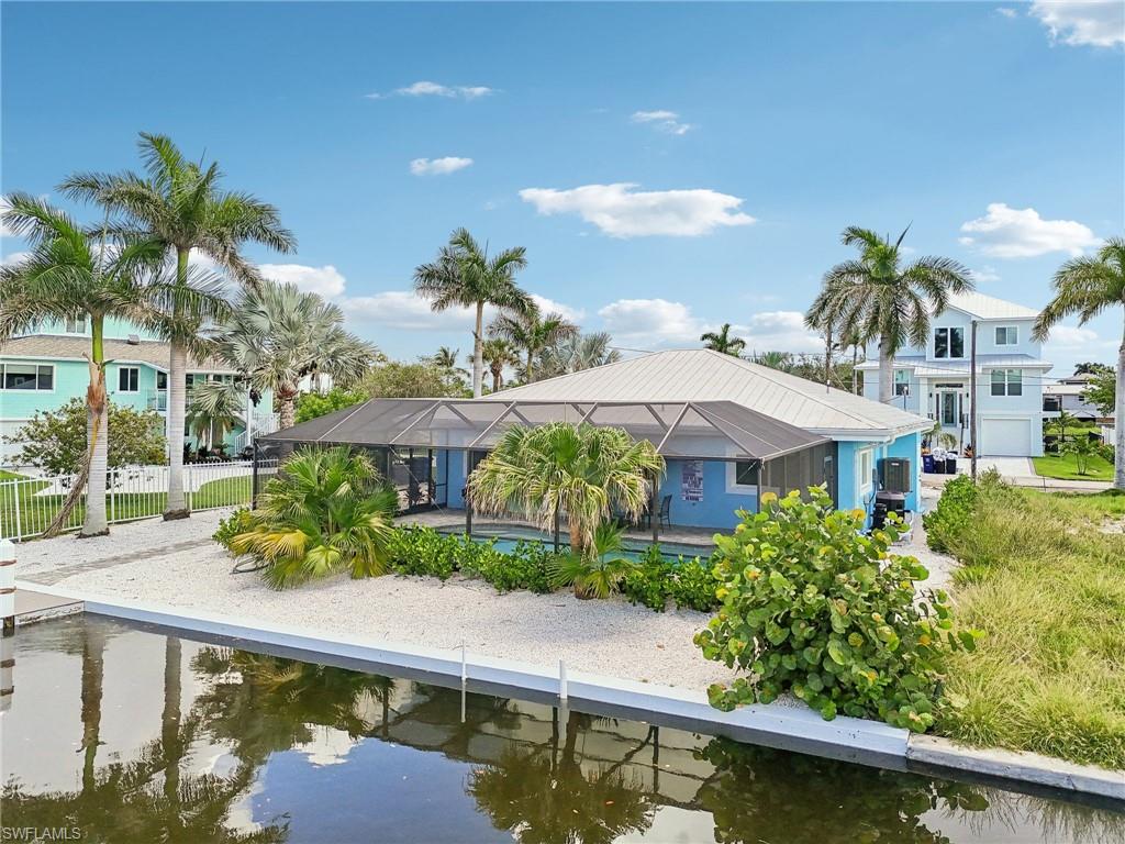 Back of property featuring a water view