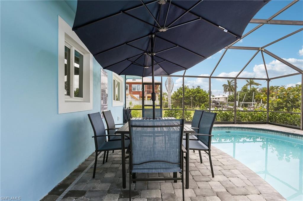 View of pool featuring a patio area and a lanai
