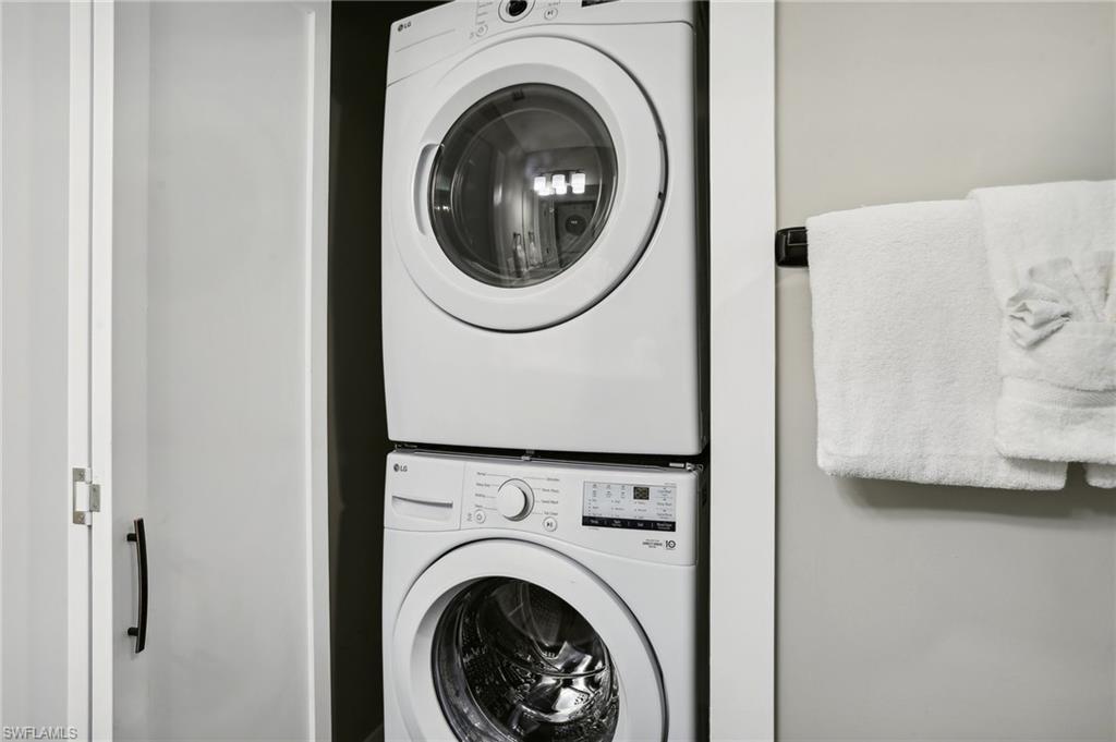 Washroom with stacked washer / drying machine