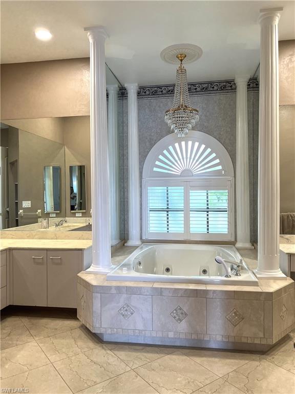 Downstairs Master Bath Arched Jacuzzi tub w custom chandelier