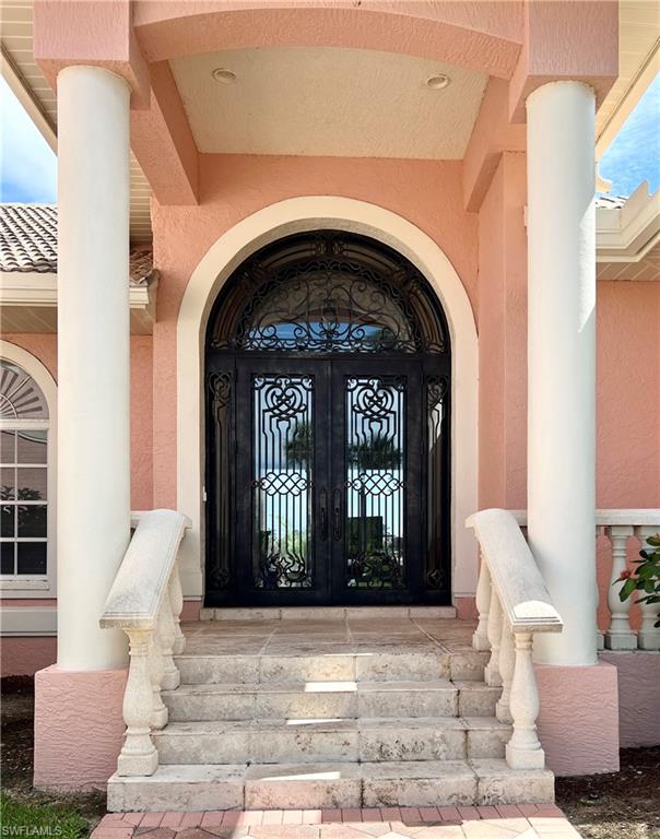 View of exterior entry with oversized double doors