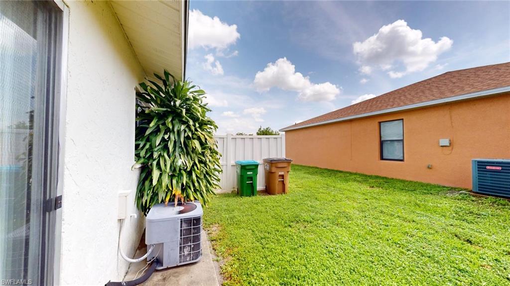 View of yard with central AC unit