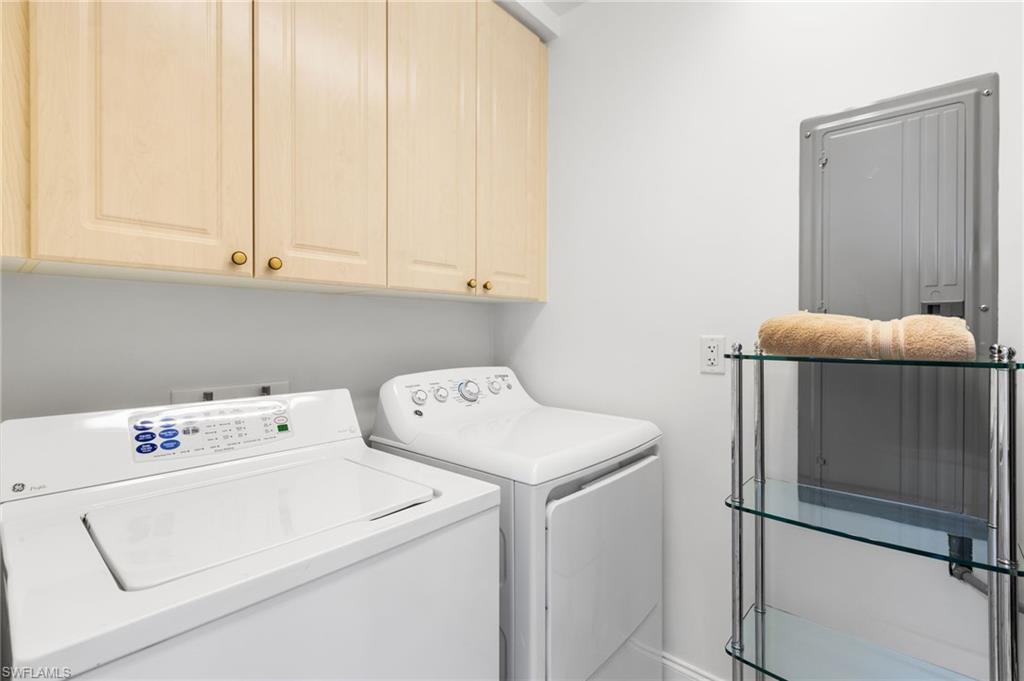 Laundry room has extra storage.