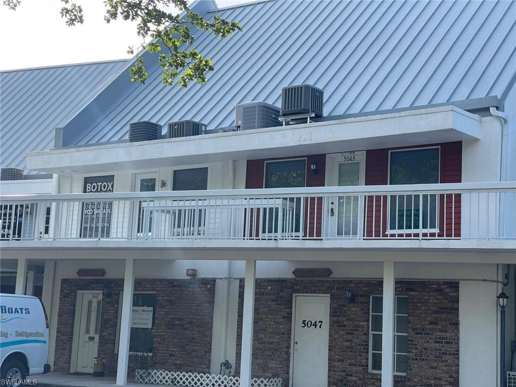 View of property with central AC unit