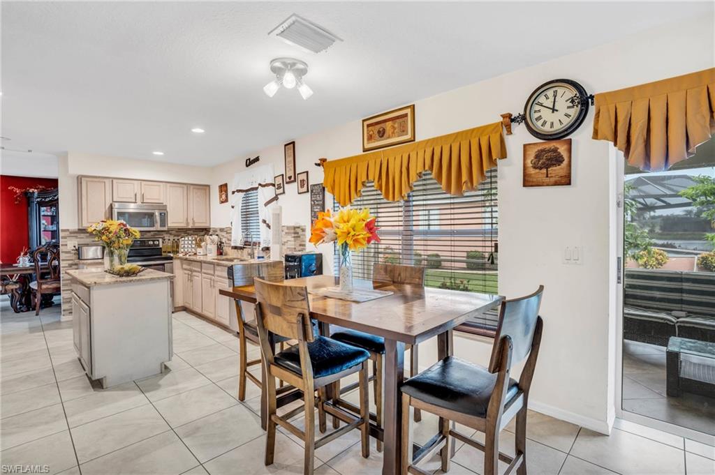 Tiled dining area with sink