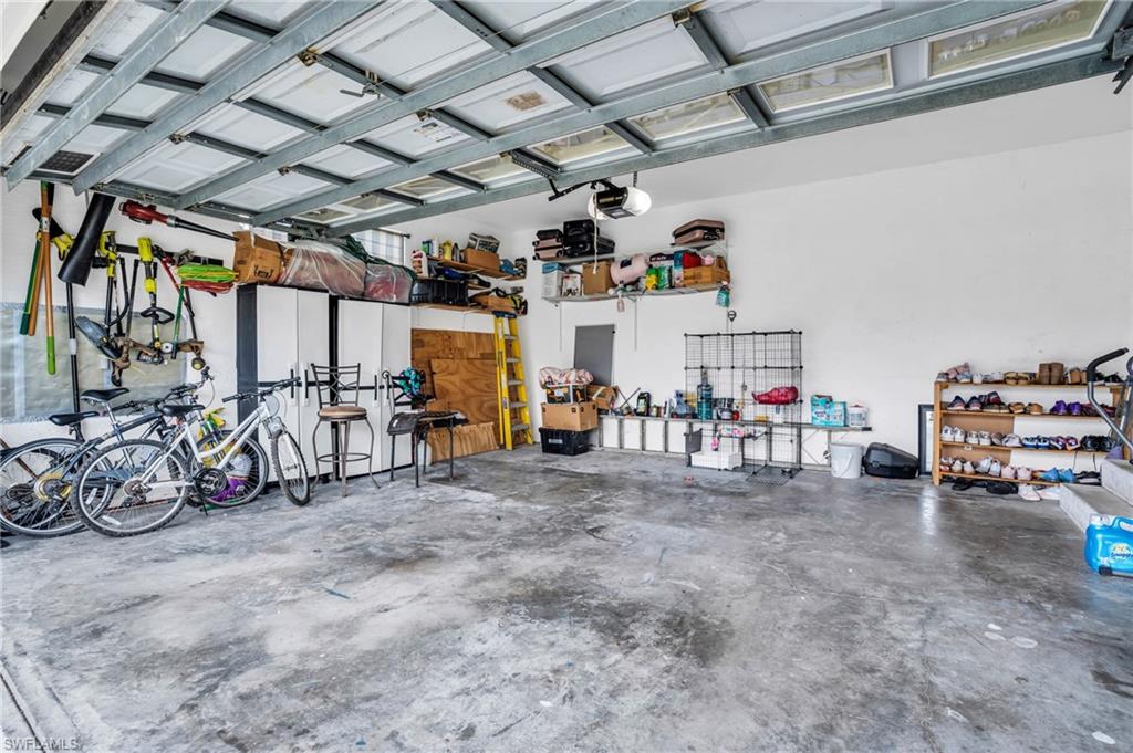 Garage featuring a garage door opener