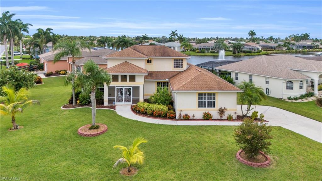 Mediterranean / spanish home featuring a front yard