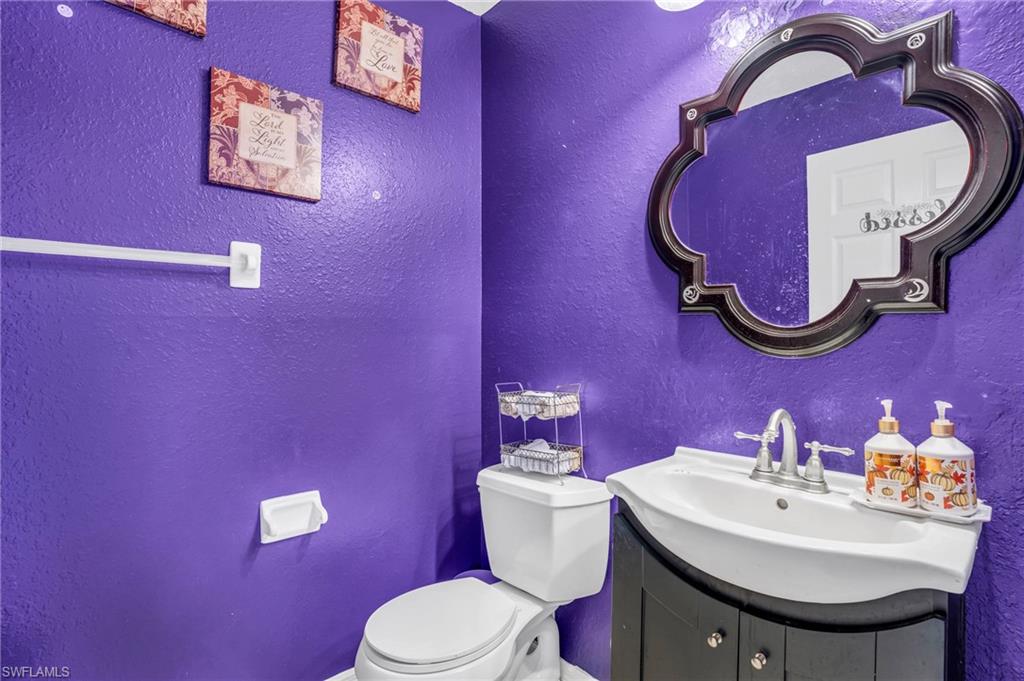 Bathroom featuring vanity and toilet