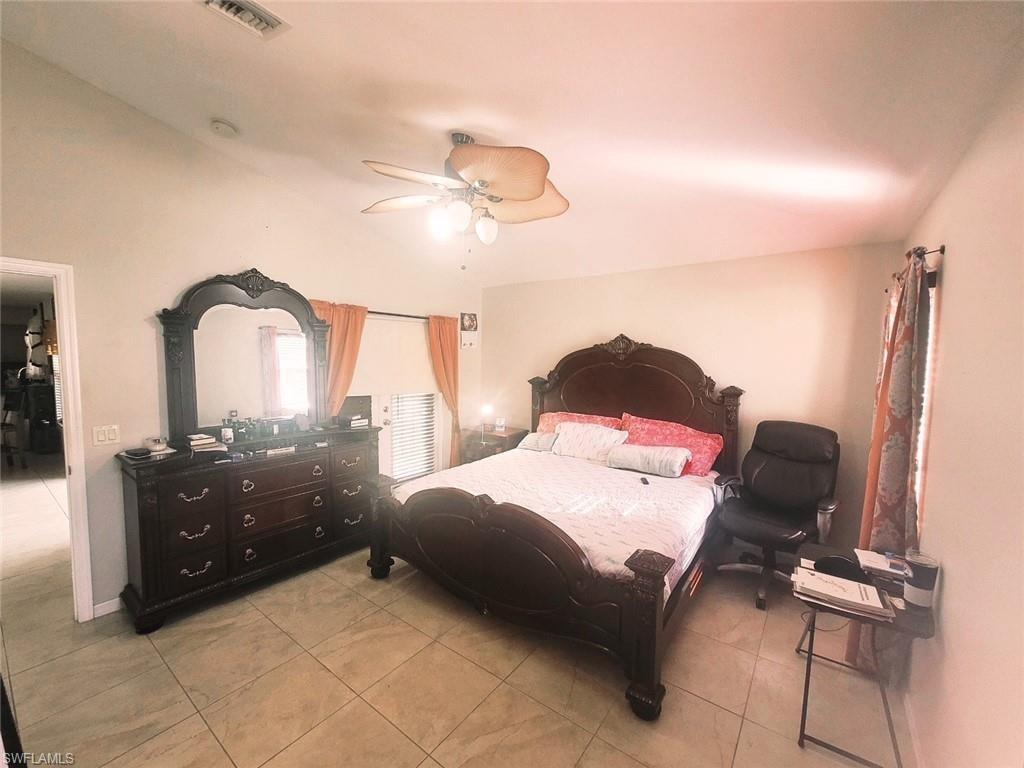 Bedroom featuring ceiling fan and light tile patterned floors