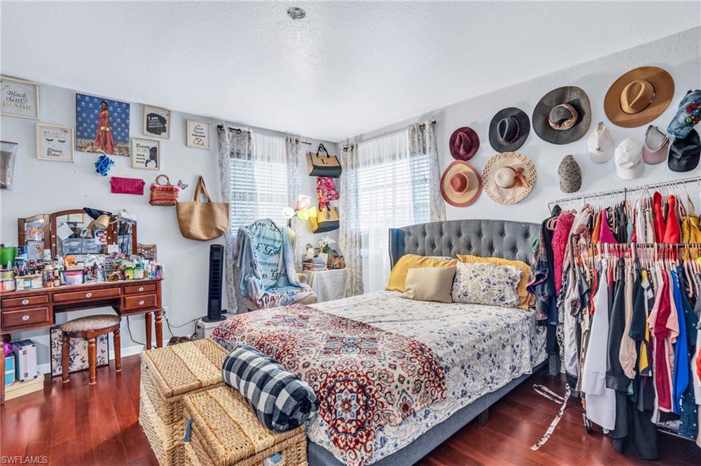 Bedroom featuring dark wood-type flooring