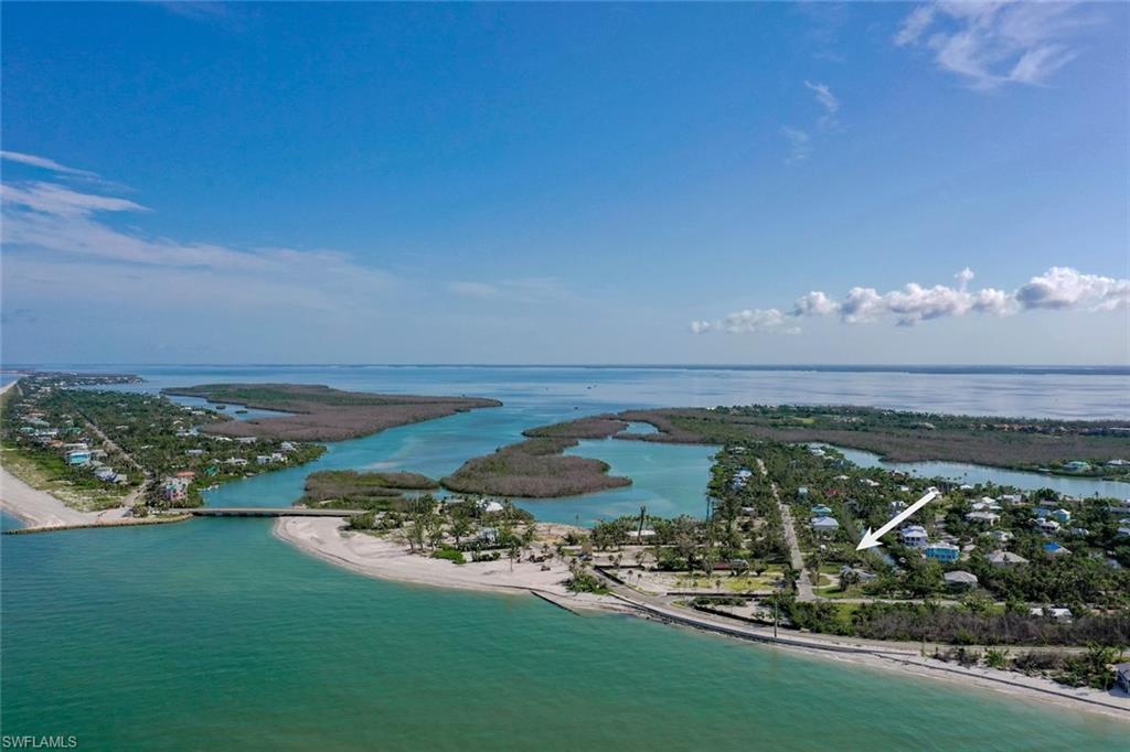 Bird's eye view featuring a view of the beach and a water view