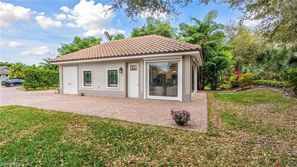 Cabana, golf cart garage, front door & seating area