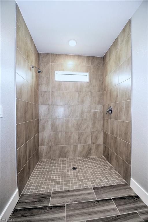 Bathroom featuring a tile shower