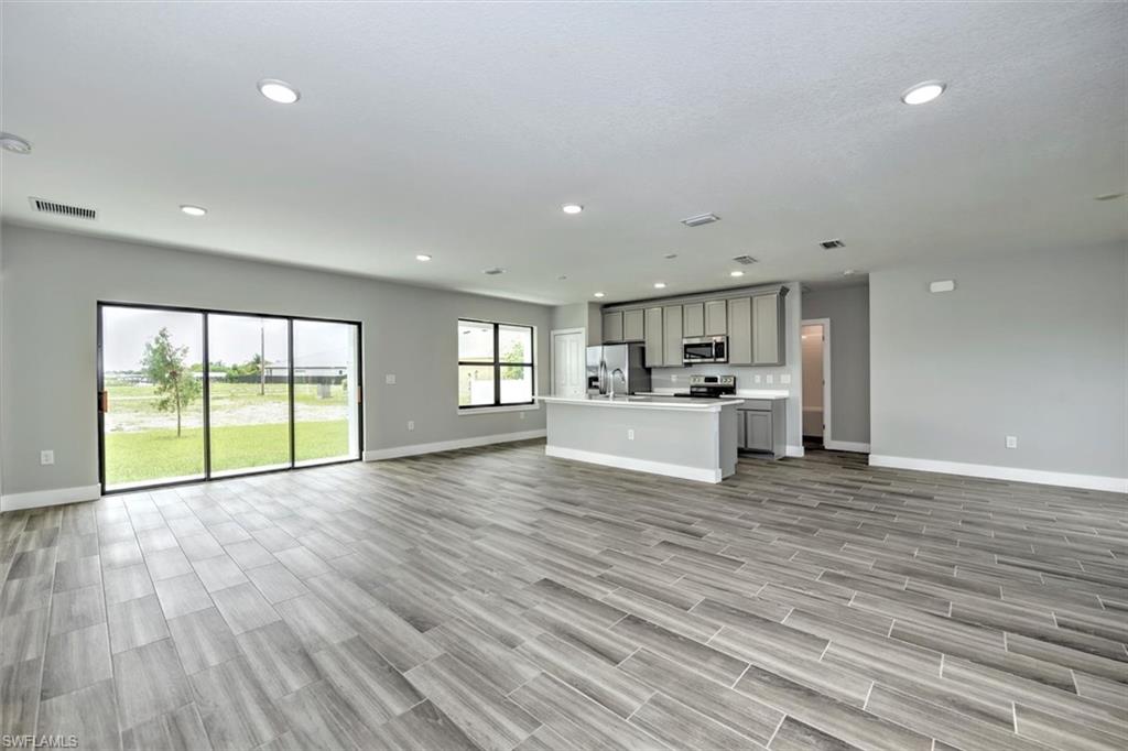 Unfurnished living room with light hardwood / wood-style flooring