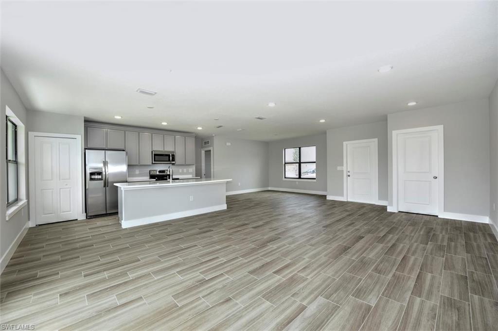 Unfurnished living room featuring light hardwood / wood-style flooring