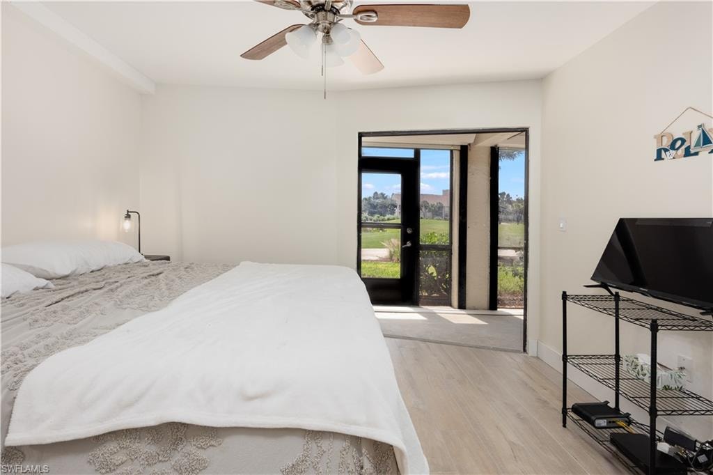Bedroom with access to exterior, ceiling fan, and light hardwood / wood-style floors